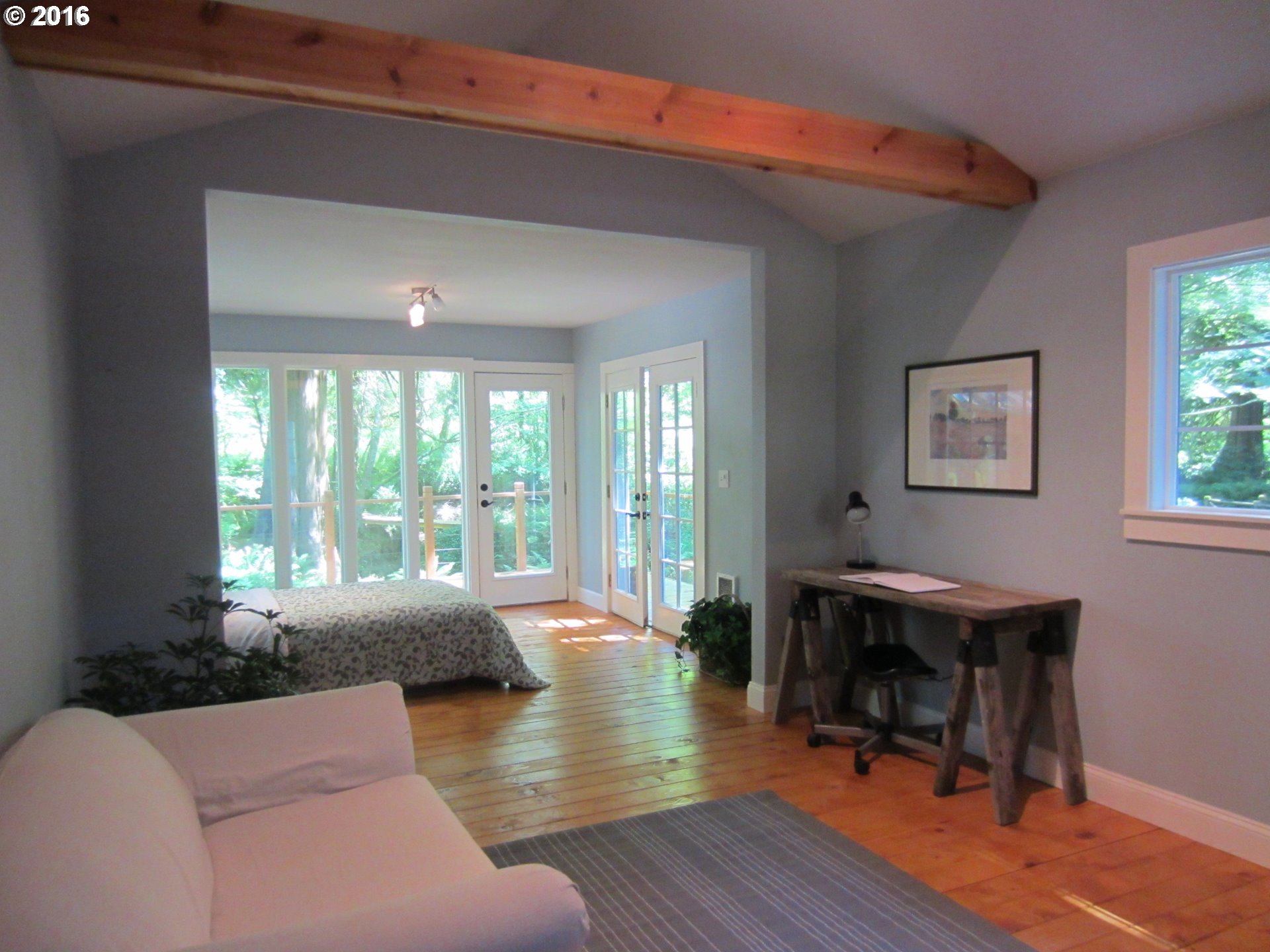 66275 East Barlow Trail Road Rhododendron, OR 97049 - Photo 8 of 30 a living room with furniture a large window and wooden floor