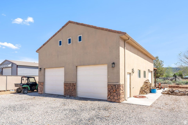 7776 Wagon Road East St. George, UT 84770 - Photo 54 of 76 Garage featuring a garage