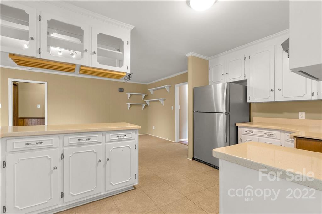 1907 Hickory Drive Lancaster, SC 29720 - Photo 14 of 39 a kitchen with cabinets and stainless steel appliances