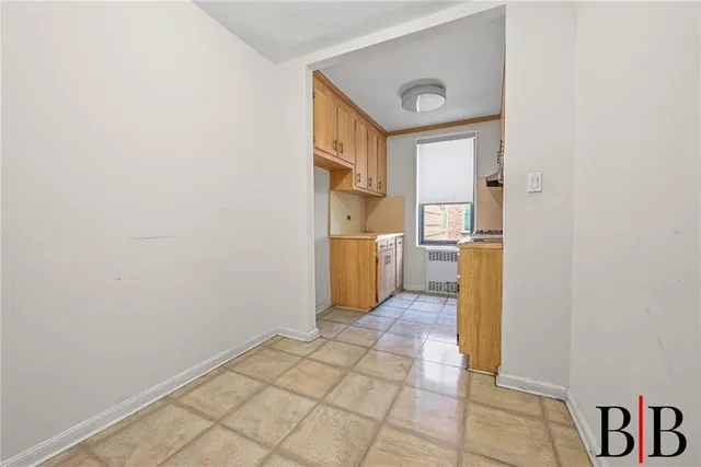 a view of a kitchen cabinets and wooden floor