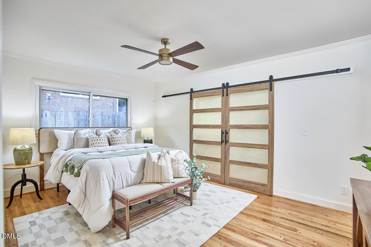 1609 Acadia Street Durham, NC 27701 - Photo 30 of 56 a bed room with a bed and a window