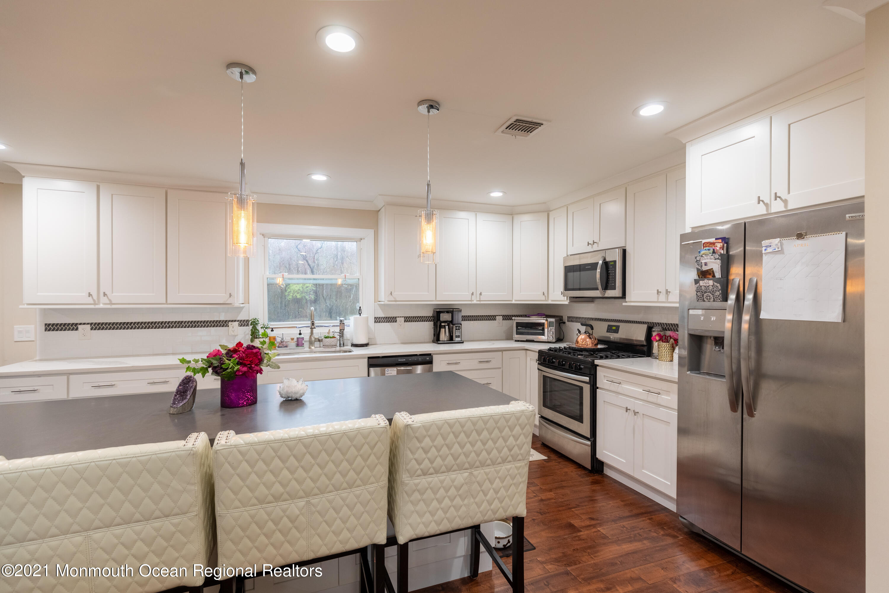 178 Bennett Road Freehold, NJ 07728 - Photo 8 of 22 a kitchen with a refrigerator and a stove top oven