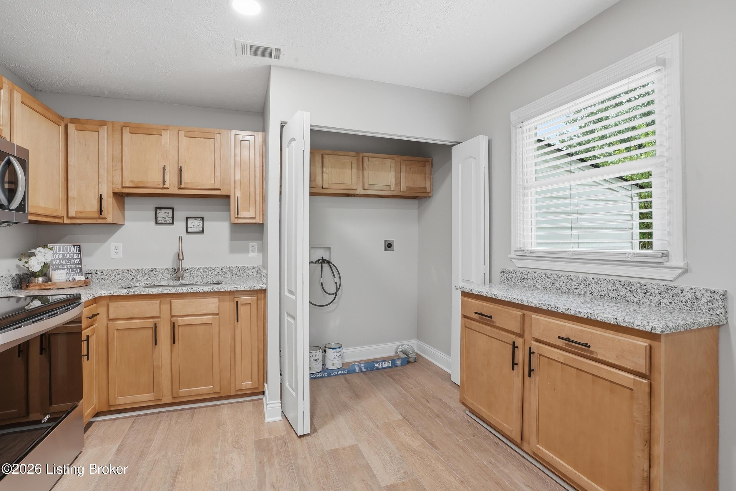 9104 New Maple Road Louisville, KY 40229 - Photo 17 of 36 Kitchen & Laundry