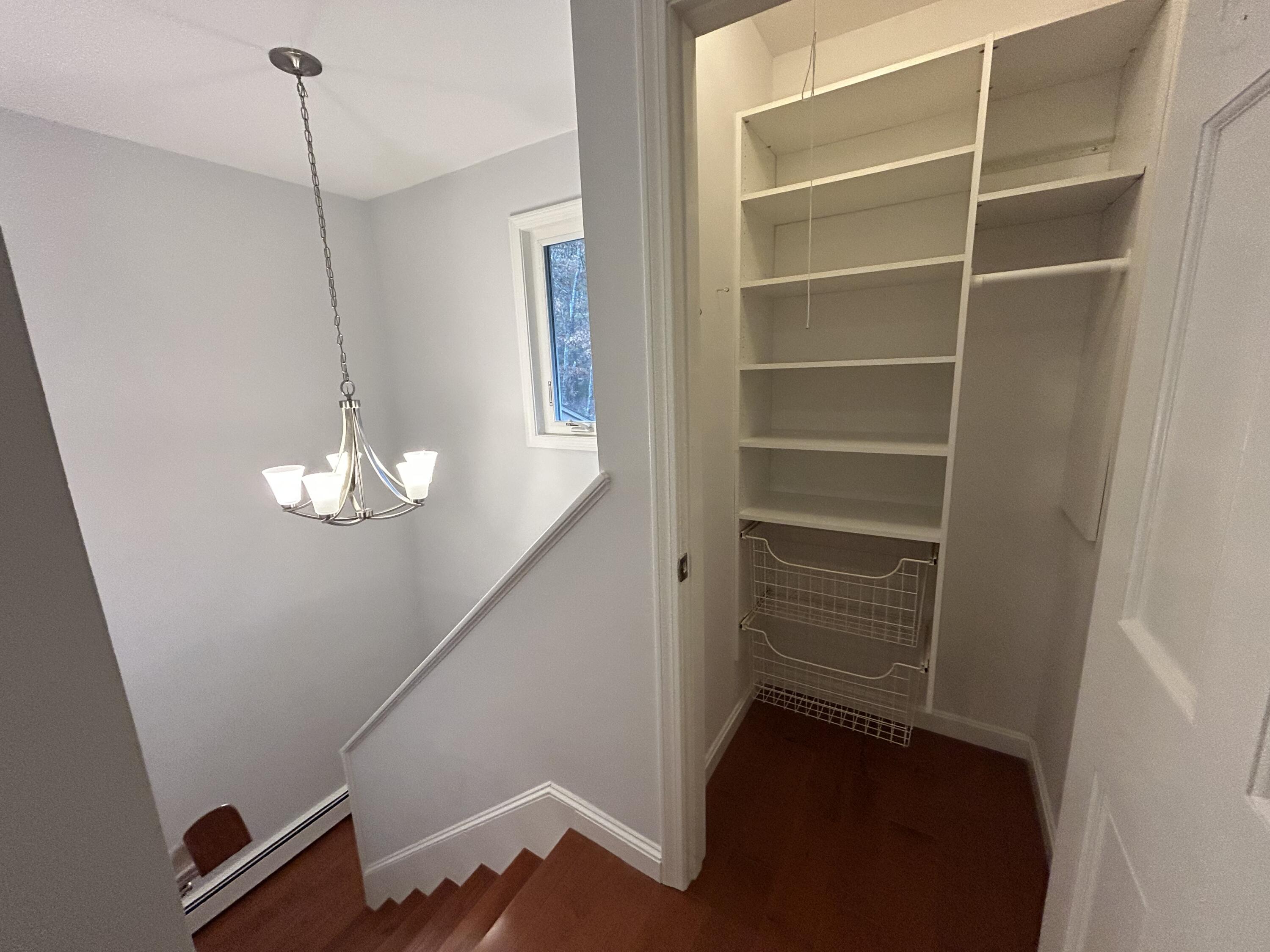 59 Main Street, Unit 192 Dennis, MA 02638 - Photo 16 of 44 a view of a room with rack and wooden floor