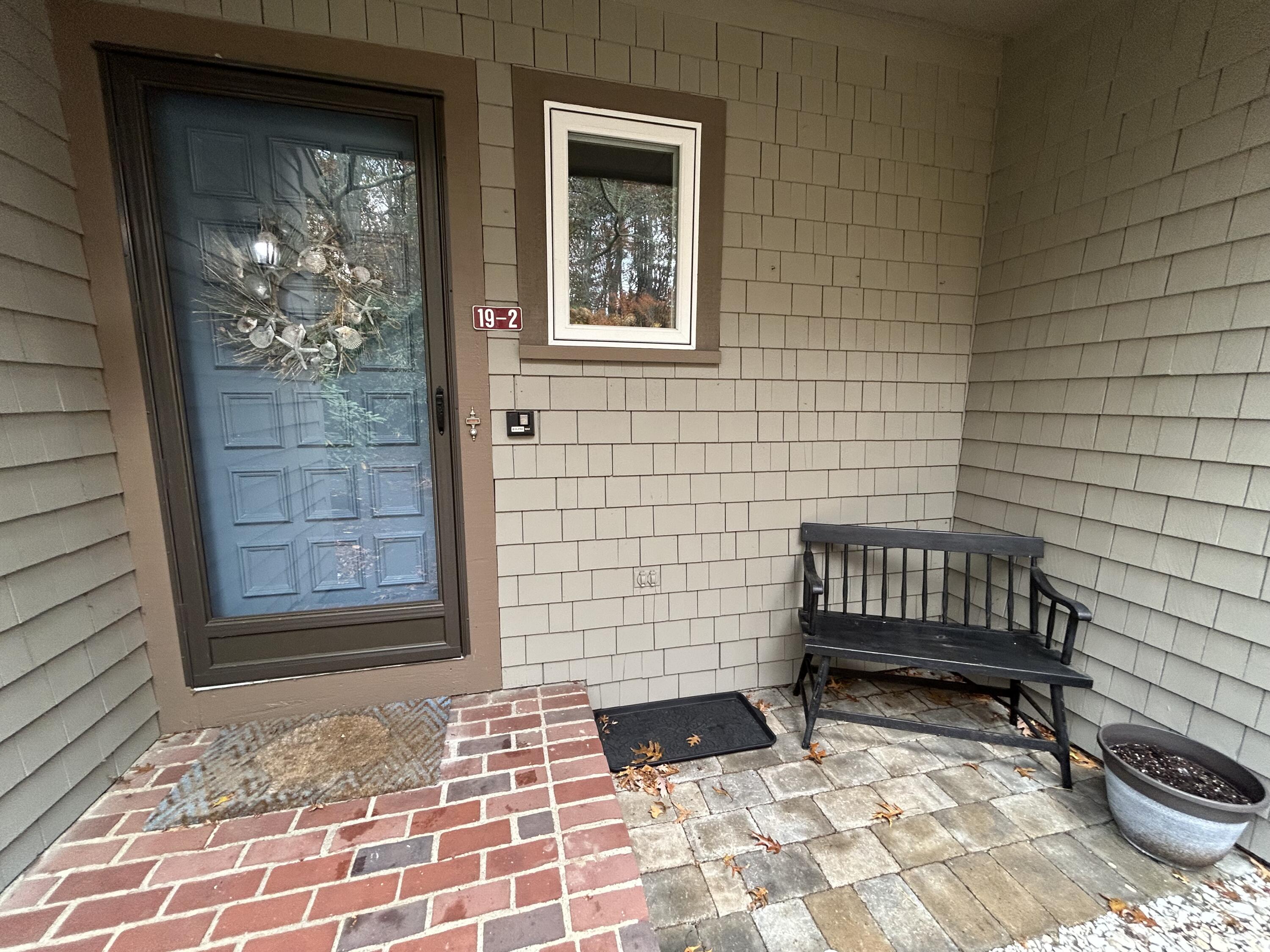 59 Main Street, Unit 192 Dennis, MA 02638 - Photo 3 of 44 a view of a door with a chair