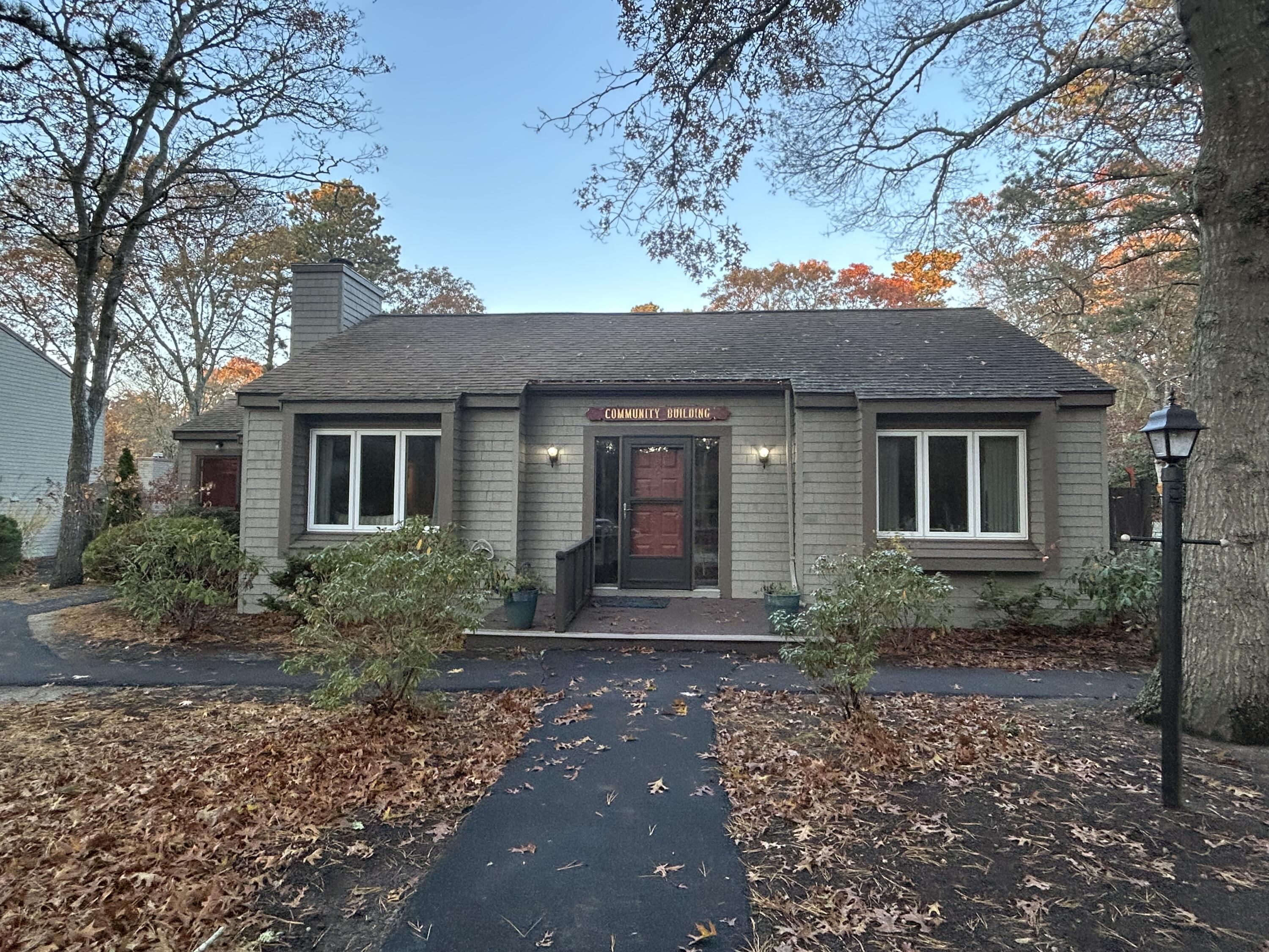 59 Main Street, Unit 192 Dennis, MA 02638 - Photo 38 of 44 a front view of a house with garden