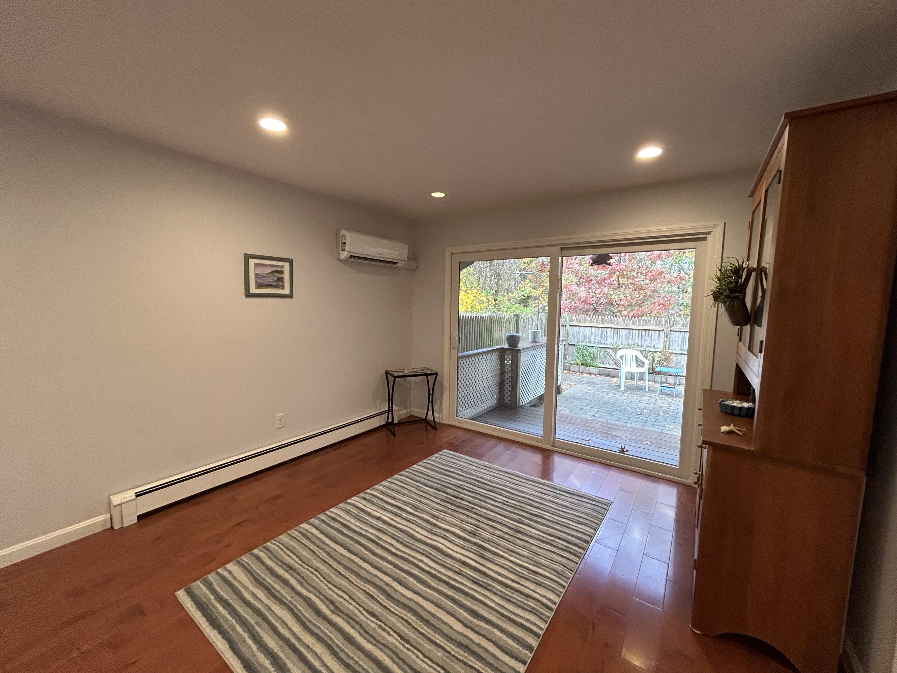 59 Main Street, Unit 192 Dennis, MA 02638 - Photo 6 of 44 a view of room with window and wooden floor