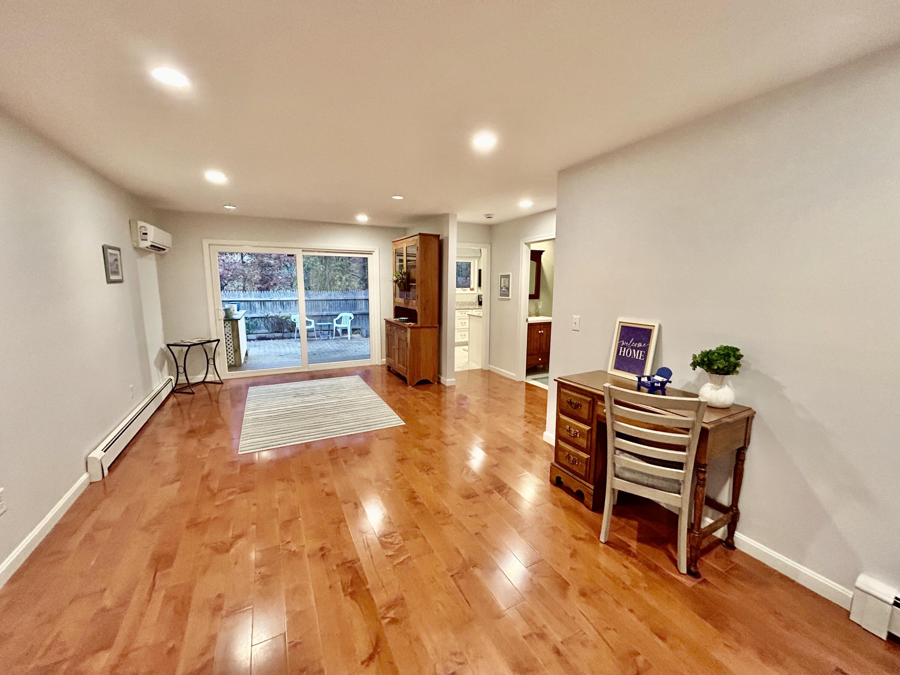 59 Main Street, Unit 192 Dennis, MA 02638 - Photo 8 of 44 a living room with furniture and a wooden floor