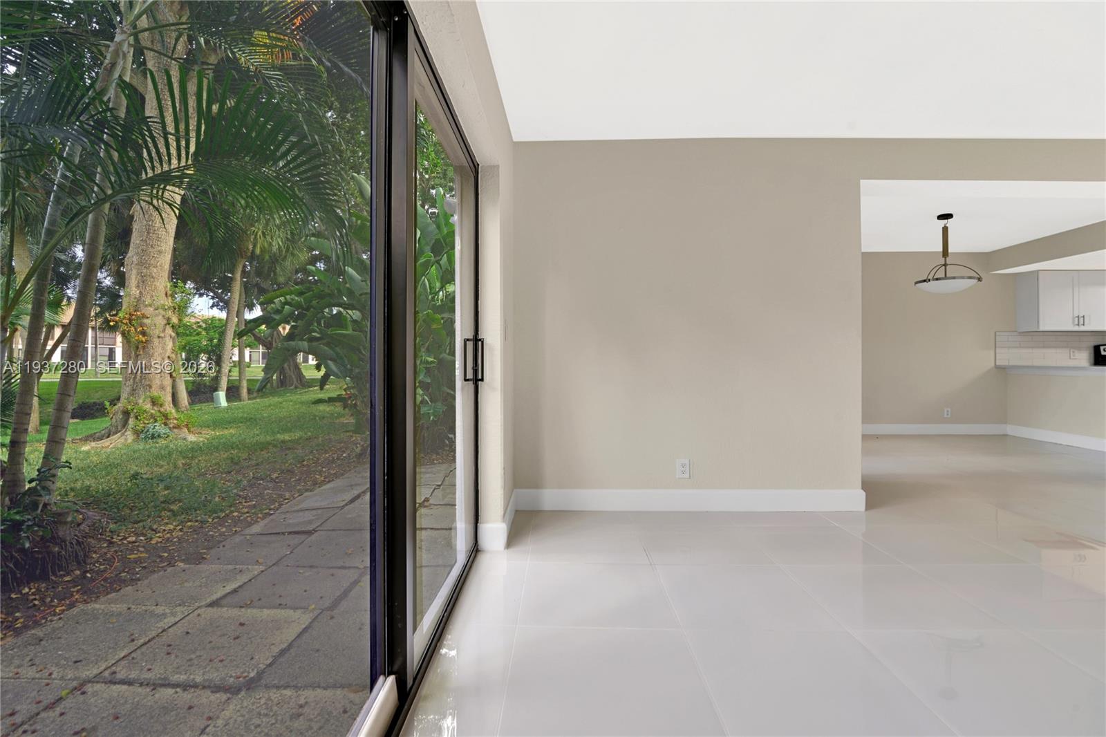 3114 Kingswood Terrace Boca Raton, FL 33431 - Photo 16 of 40 a view of a back yard from a corridor