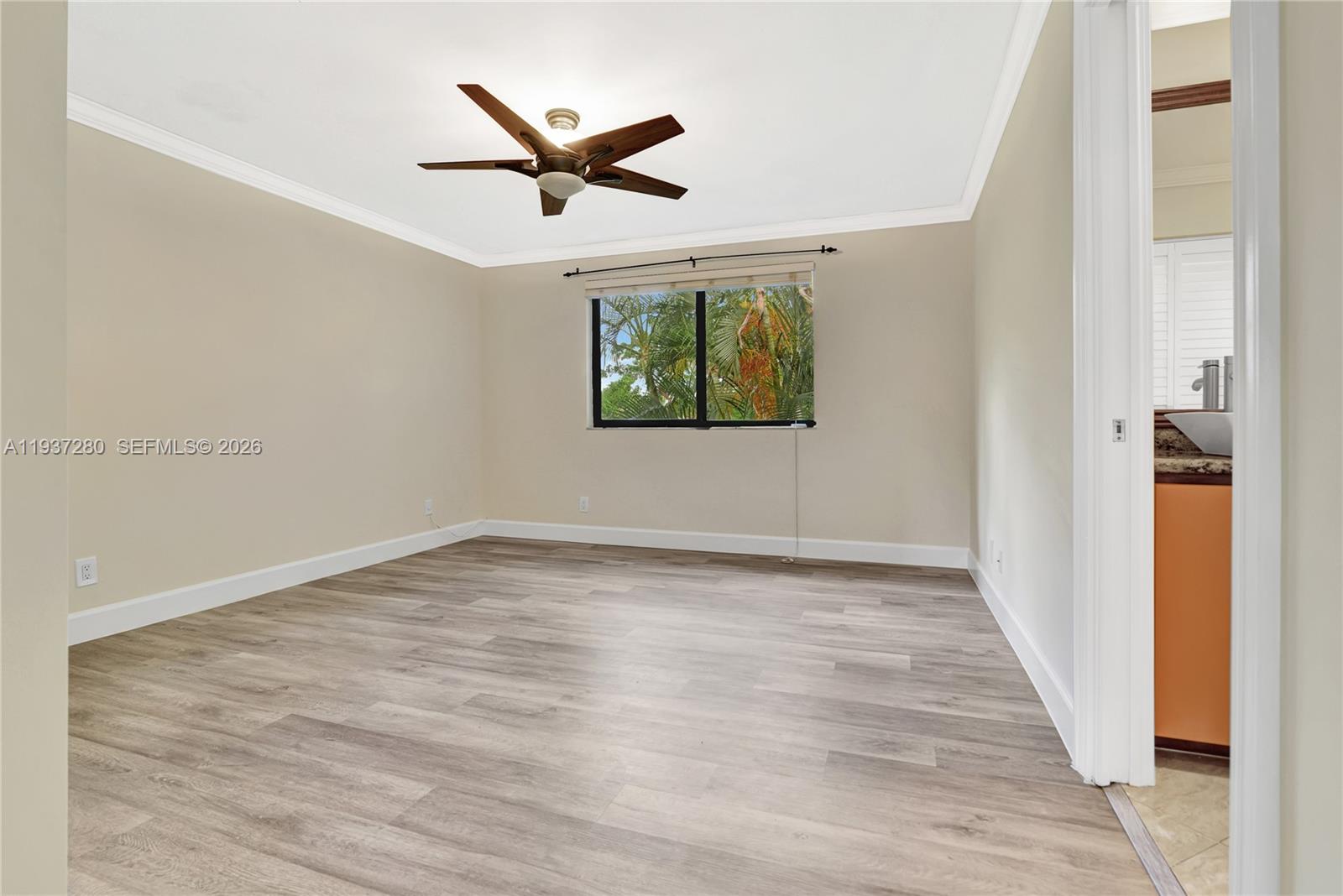 3114 Kingswood Terrace Boca Raton, FL 33431 - Photo 21 of 40 a view of a hallway with wooden floor and a ceiling fan