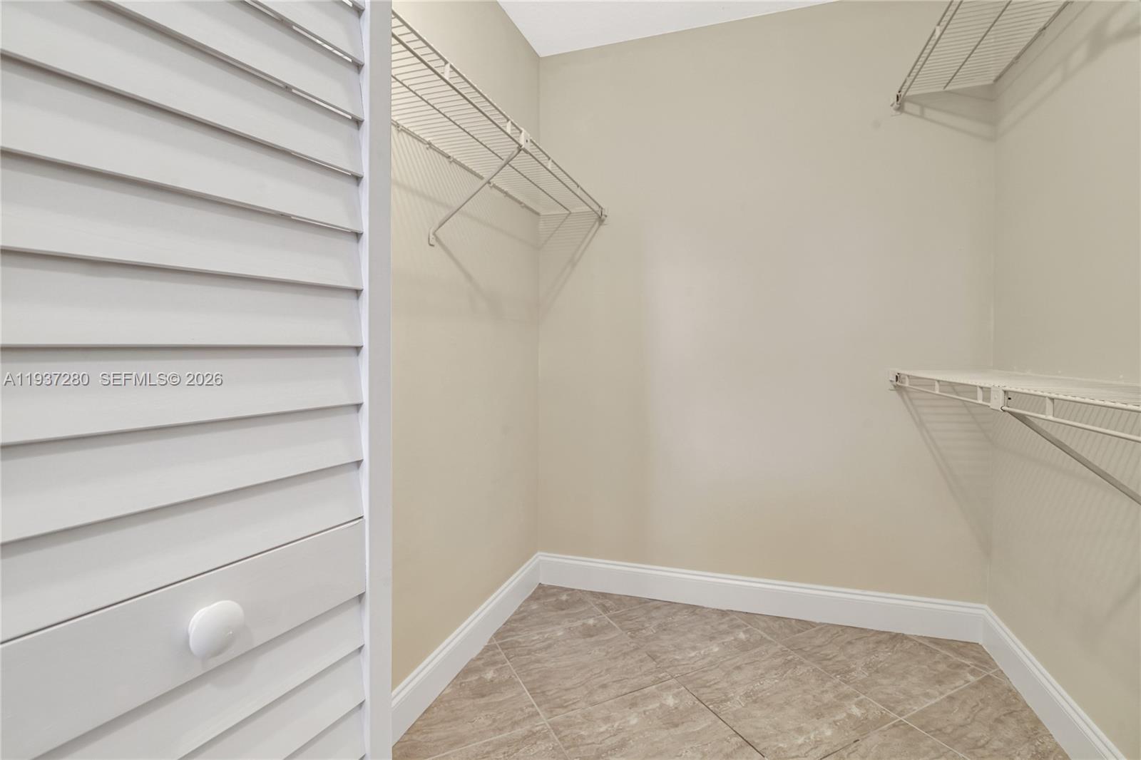 3114 Kingswood Terrace Boca Raton, FL 33431 - Photo 24 of 40 a view of an empty walk in closet