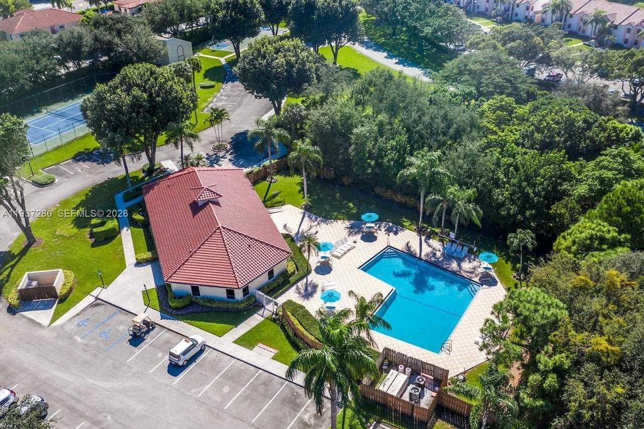 3114 Kingswood Terrace Boca Raton, FL 33431 - Photo 33 of 40 an aerial view of a house with a yard and potted plants