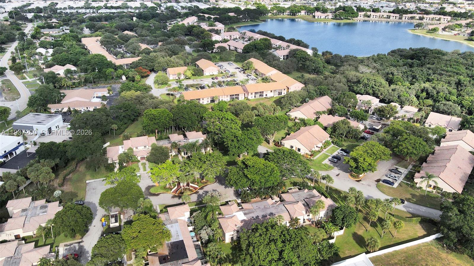 3114 Kingswood Terrace Boca Raton, FL 33431 - Photo 36 of 40 an aerial view of lake residential houses with outdoor space and trees
