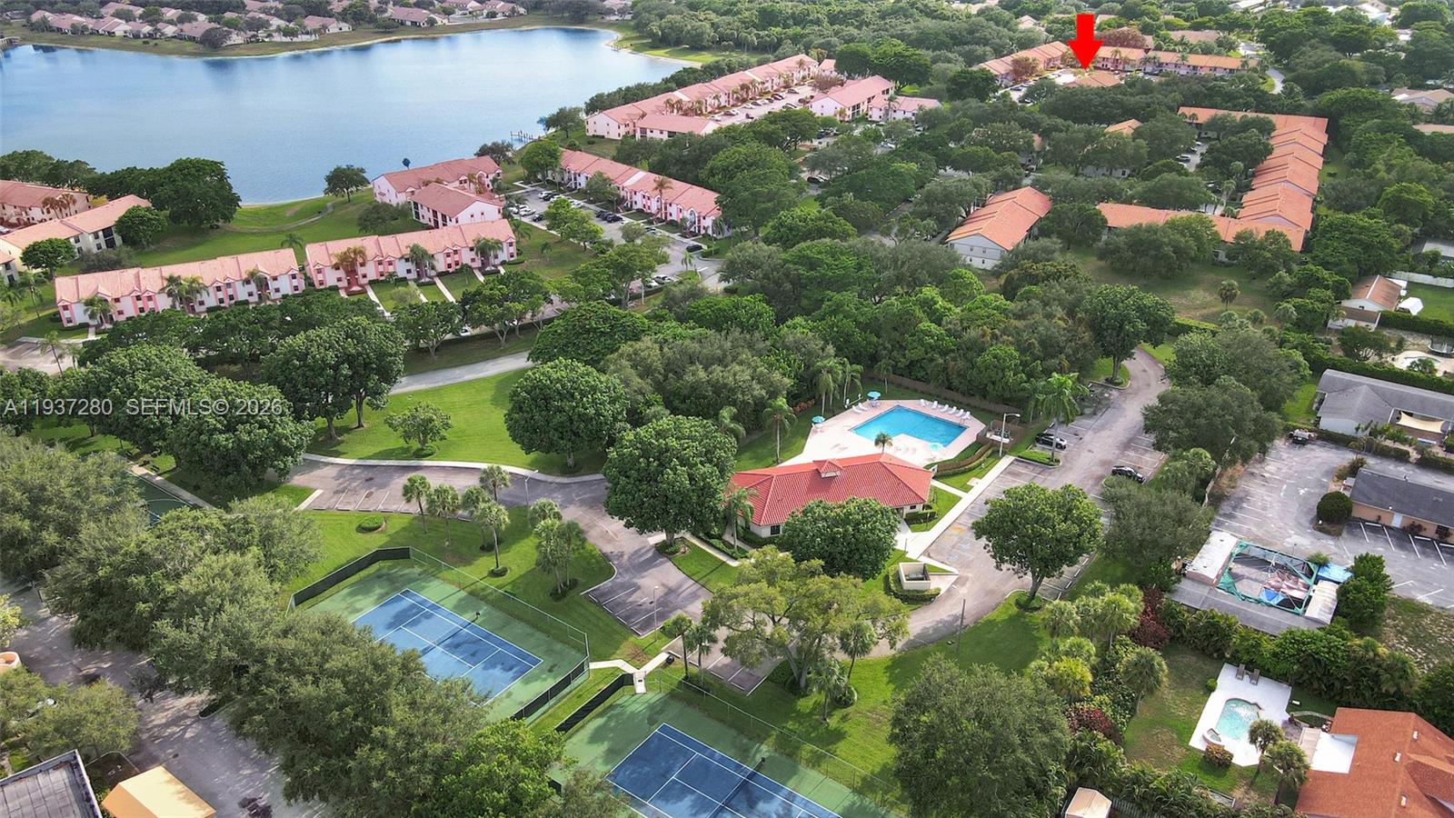 3114 Kingswood Terrace Boca Raton, FL 33431 - Photo 38 of 40 an aerial view of a house with a yard and lake view