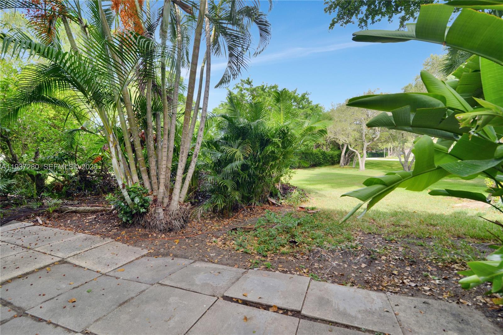 3114 Kingswood Terrace Boca Raton, FL 33431 - Photo 39 of 40 a backyard of a house with lots of green space