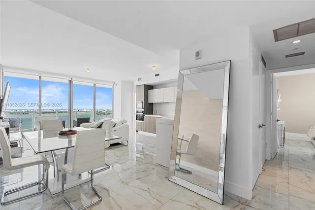 a kitchen with stainless steel appliances a stove top oven a sink and cabinets