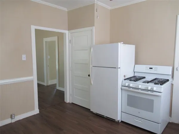a kitchen with a stove and a refrigerator