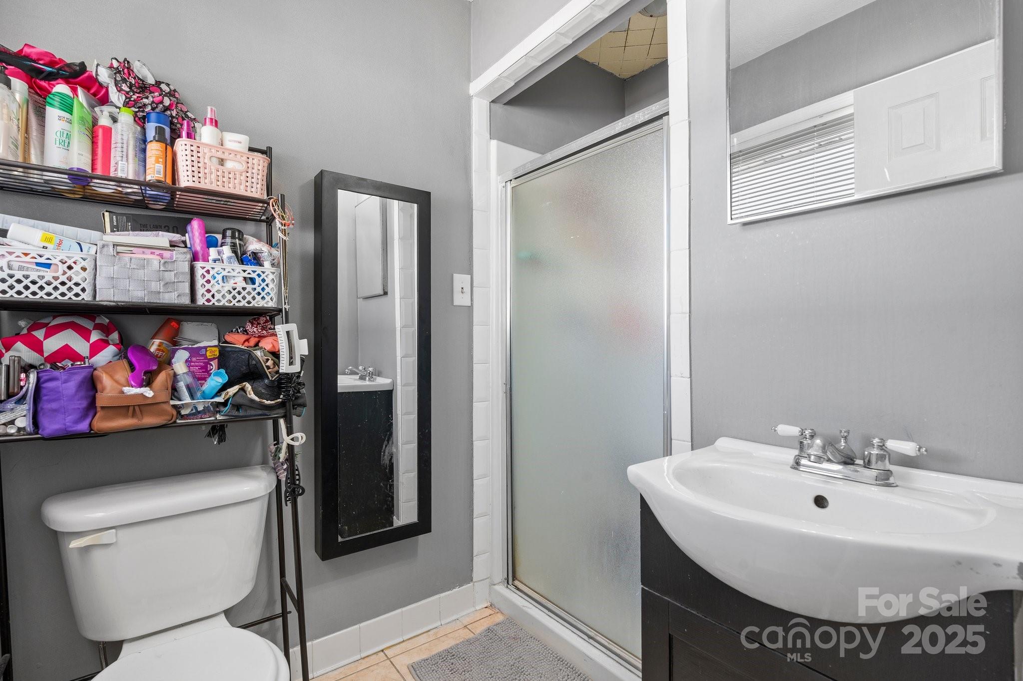 2596 Sweetbriar Circle Lenoir, NC 28645 - Photo 17 of 47 a bathroom with a sink toilet and shower