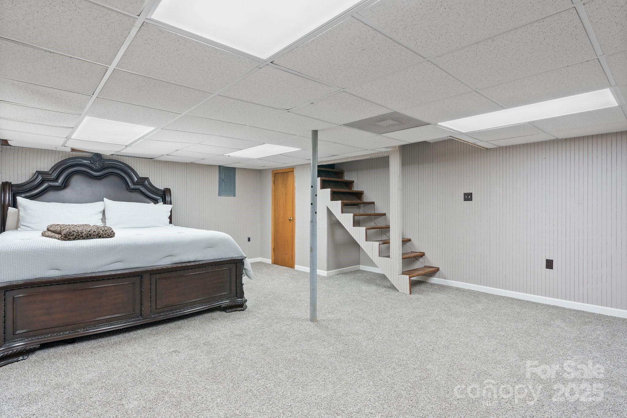 2596 Sweetbriar Circle Lenoir, NC 28645 - Photo 21 of 47 a bedroom with a bed and a table