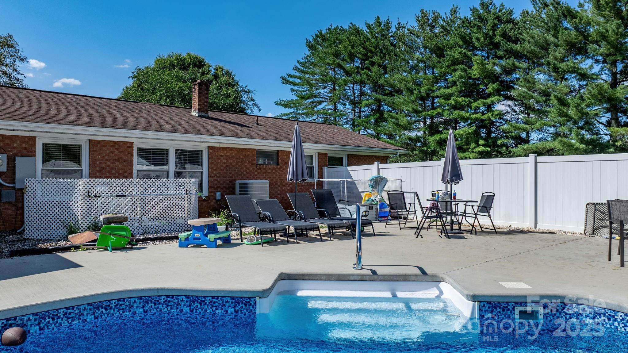 2596 Sweetbriar Circle Lenoir, NC 28645 - Photo 35 of 47 a front view of a house with sitting area