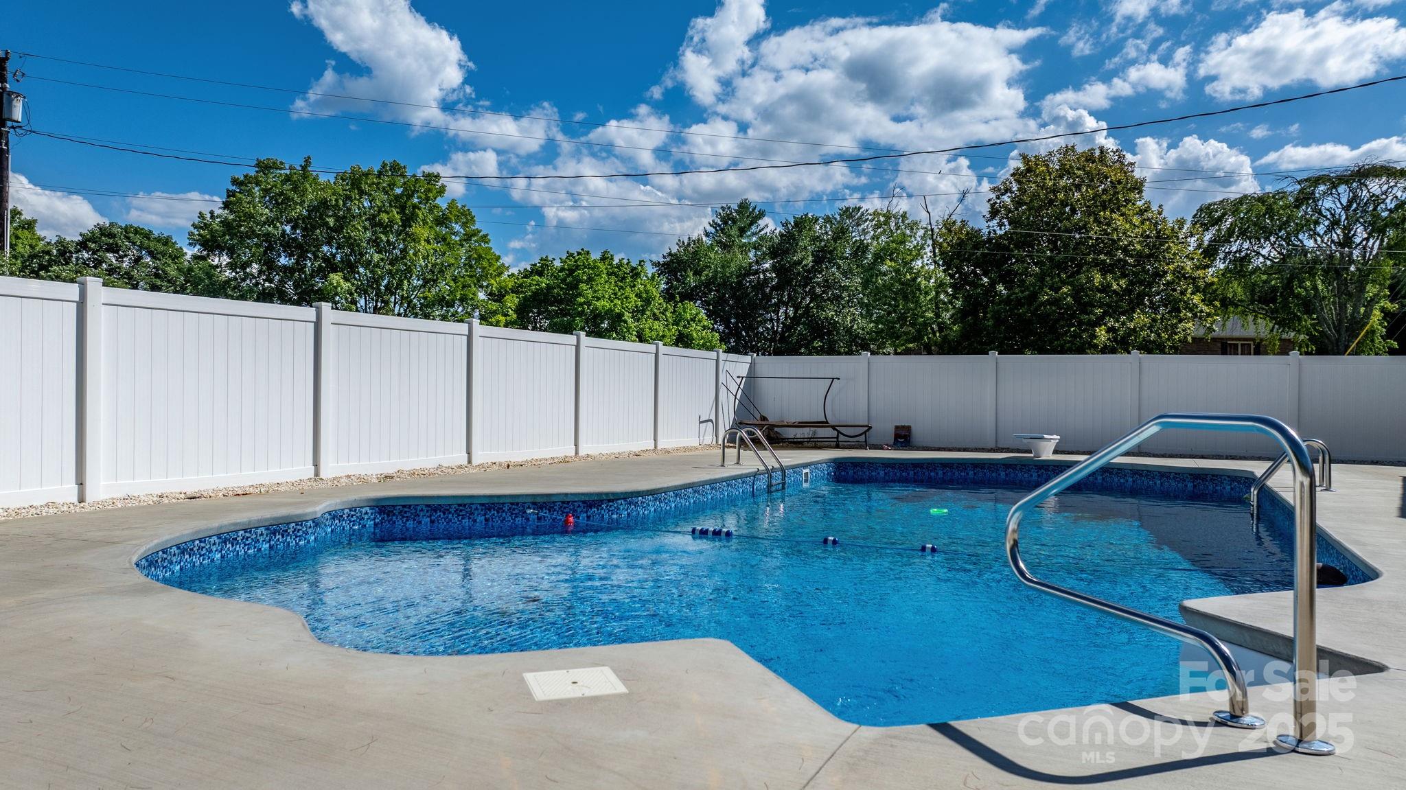 2596 Sweetbriar Circle Lenoir, NC 28645 - Photo 36 of 47 a backyard of a house with table and chairs