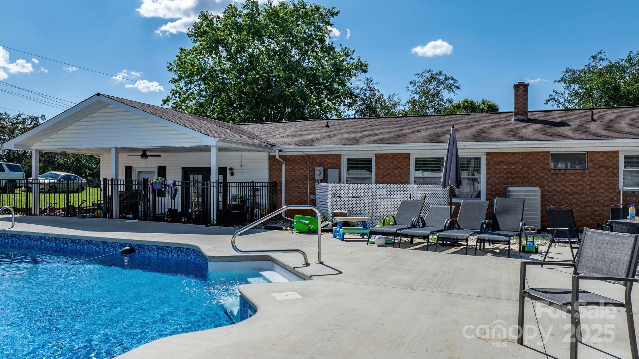 2596 Sweetbriar Circle Lenoir, NC 28645 - Photo 37 of 47 a view of house with yard outdoor seating and plants
