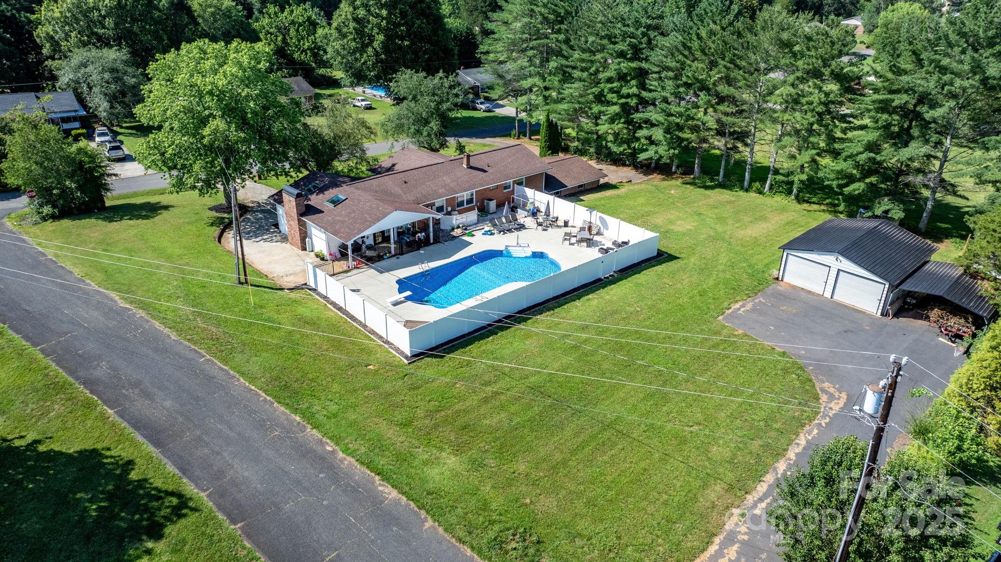 2596 Sweetbriar Circle Lenoir, NC 28645 - Photo 5 of 47 an aerial view of a house with a garden