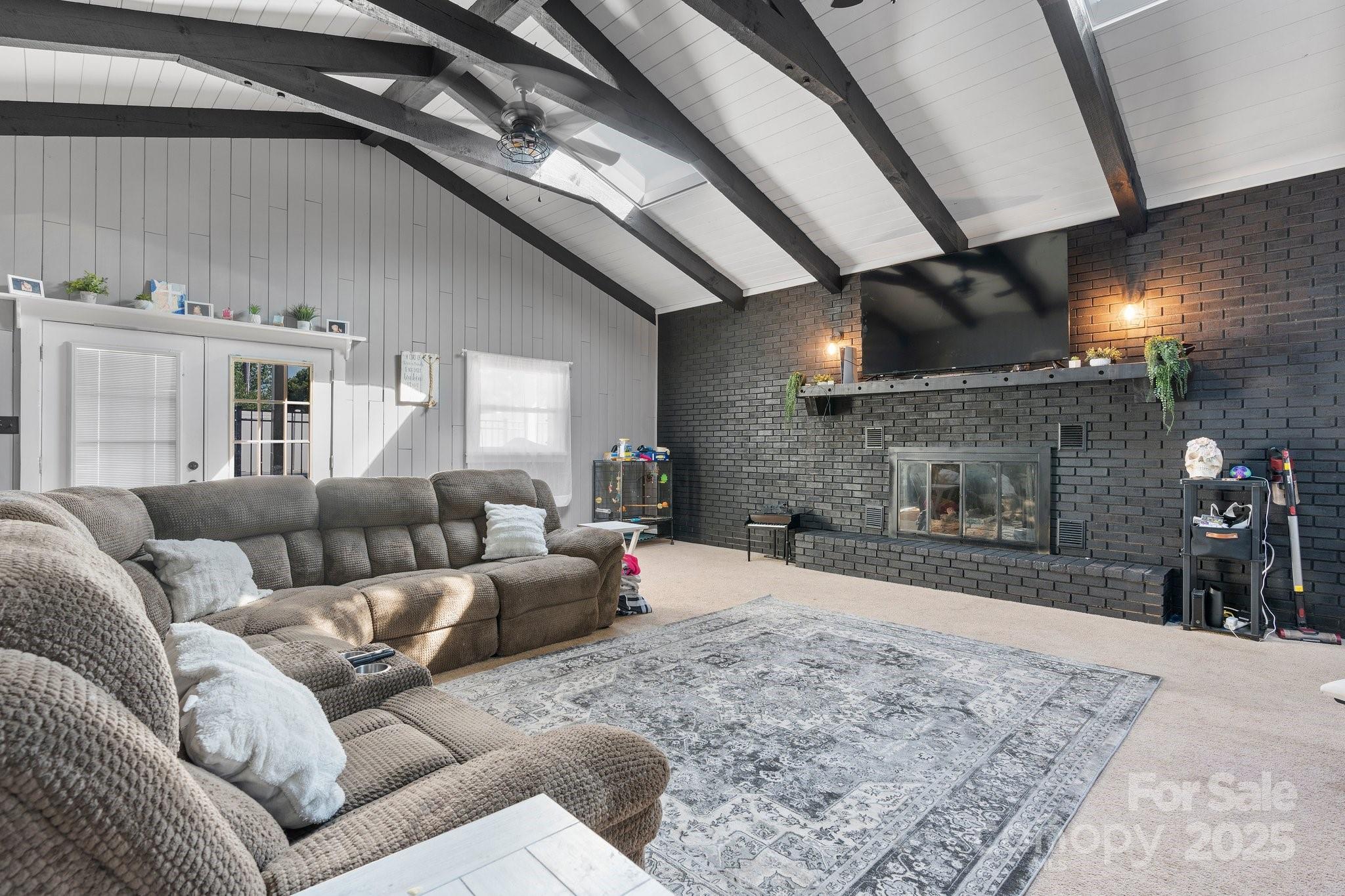 2596 Sweetbriar Circle Lenoir, NC 28645 - Photo 6 of 47 a living room with furniture and a fireplace