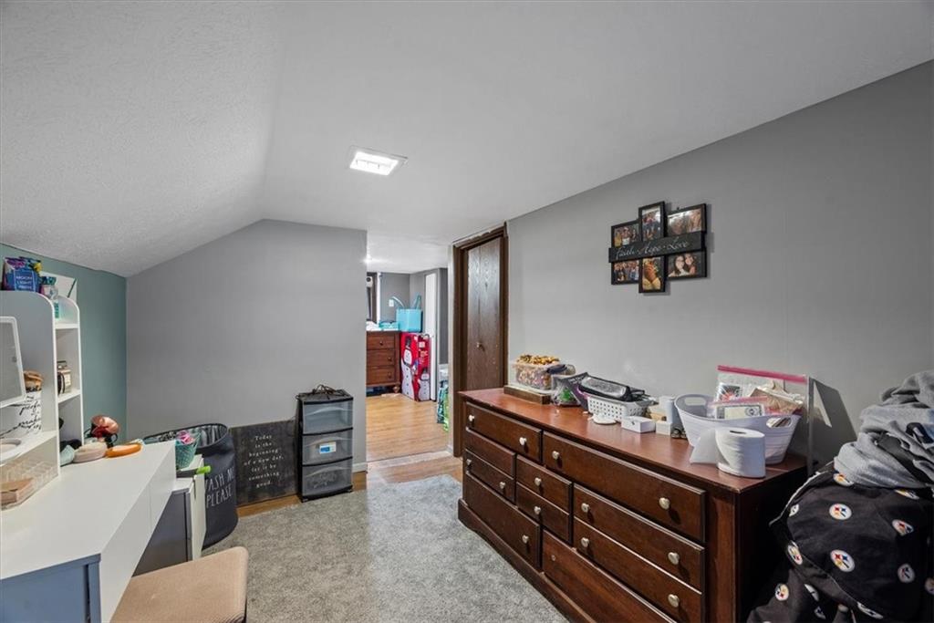 125 Center Avenue Burgettstown, PA 15021 - Photo 27 of 32 a room with a baby crib furniture and a flat screen tv
