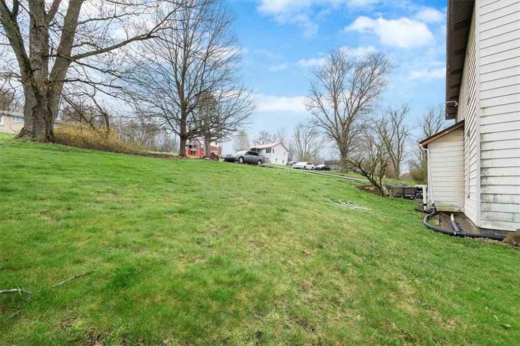 125 Center Avenue Burgettstown, PA 15021 - Photo 31 of 32 a view of a backyard with large trees