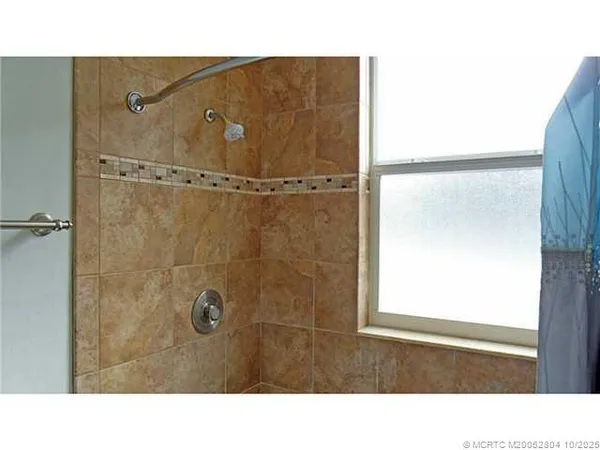 a bathroom with a sink and a shower