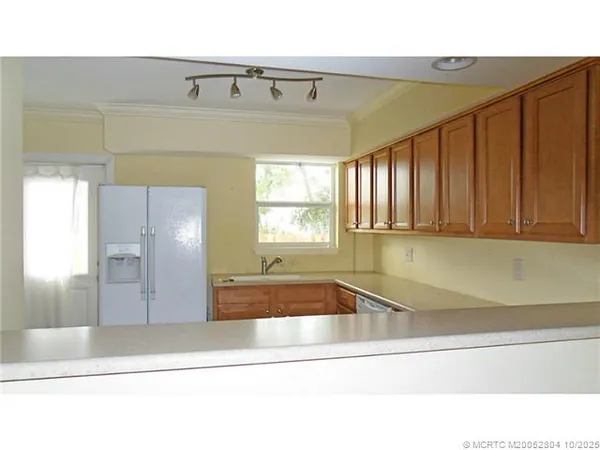 a bathroom with a bathtub and a window