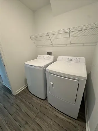 a utility room with dryer and washer