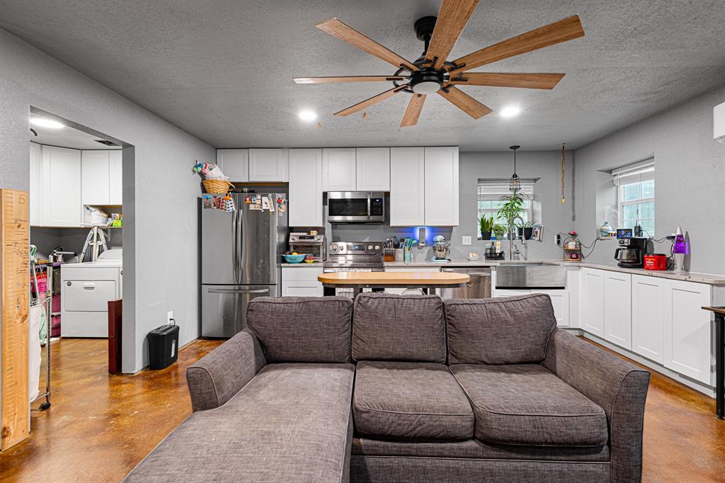 14293 South Fm 372 Valley View Valley View, TX 76272 - Photo 25 of 35 a living room with furniture and kitchen view