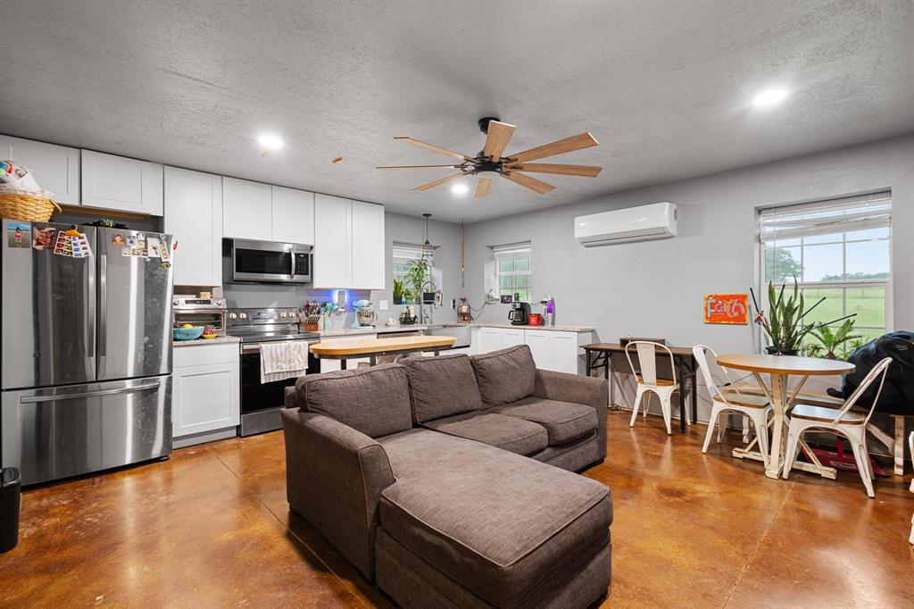 14293 South Fm 372 Valley View Valley View, TX 76272 - Photo 26 of 35 a living room with furniture kitchen view and a dining table