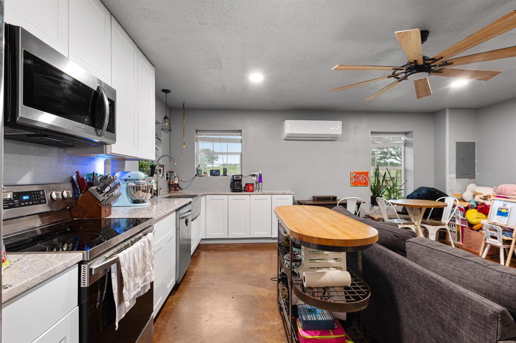 14293 South Fm 372 Valley View Valley View, TX 76272 - Photo 27 of 35 a kitchen with a sink appliances and cabinets