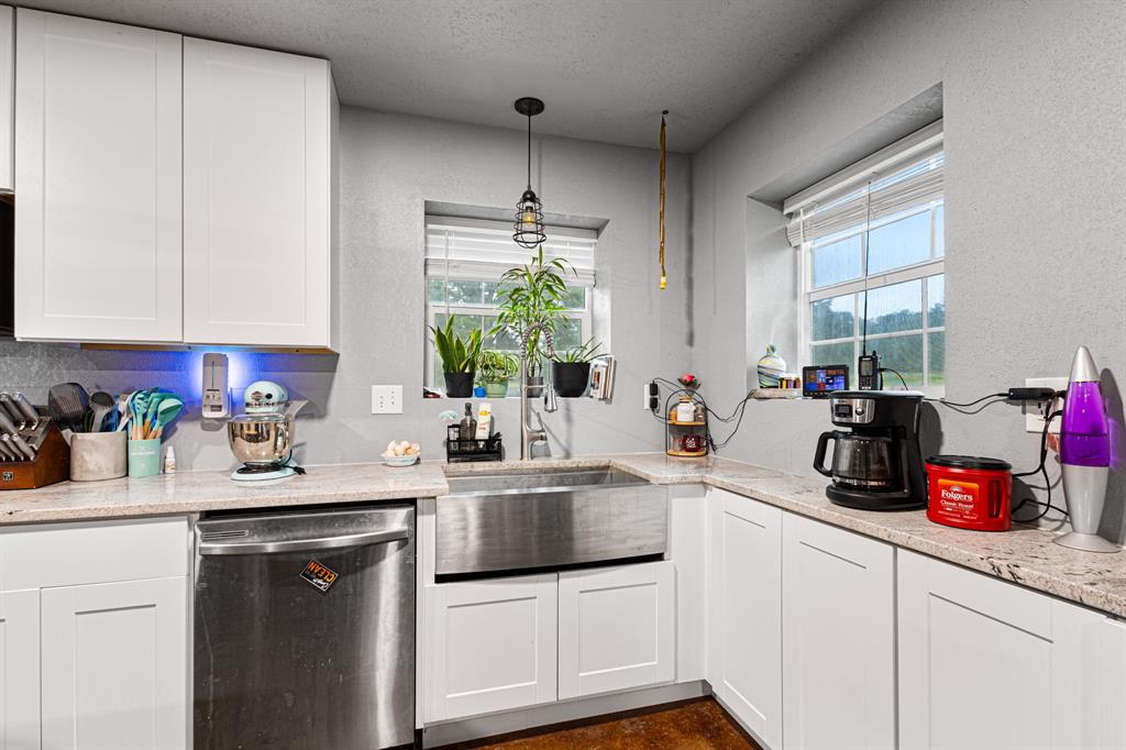 14293 South Fm 372 Valley View Valley View, TX 76272 - Photo 29 of 35 a kitchen with a sink stove and cabinets