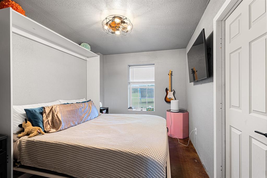 14293 South Fm 372 Valley View Valley View, TX 76272 - Photo 30 of 35 a bedroom with a bed and a window