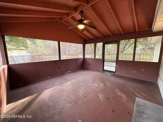 a white toilet sitting next to a bathroom sink and a shower