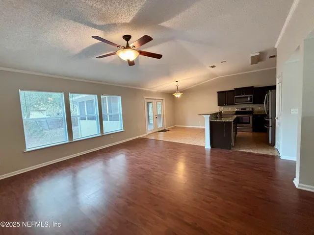 a kitchen with a stove and a sink