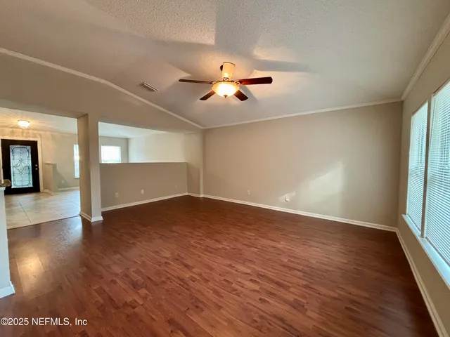 a view of an empty room with a window