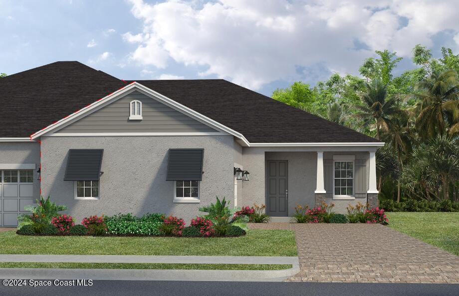 3098 Pangea Circle Melbourne, FL 32940 - Photo 1 of 2 a front view of a house with a yard