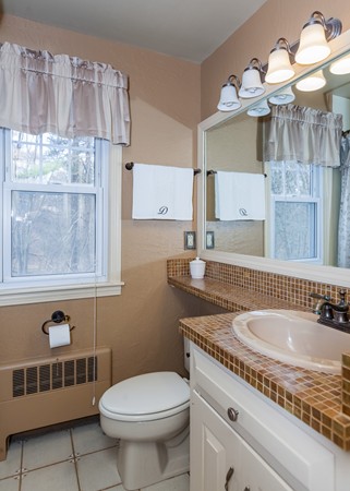216 Tiffany Street Springfield, MA 01108 - Photo 17 of 30 a bathroom with a granite countertop sink a toilet and bathtub