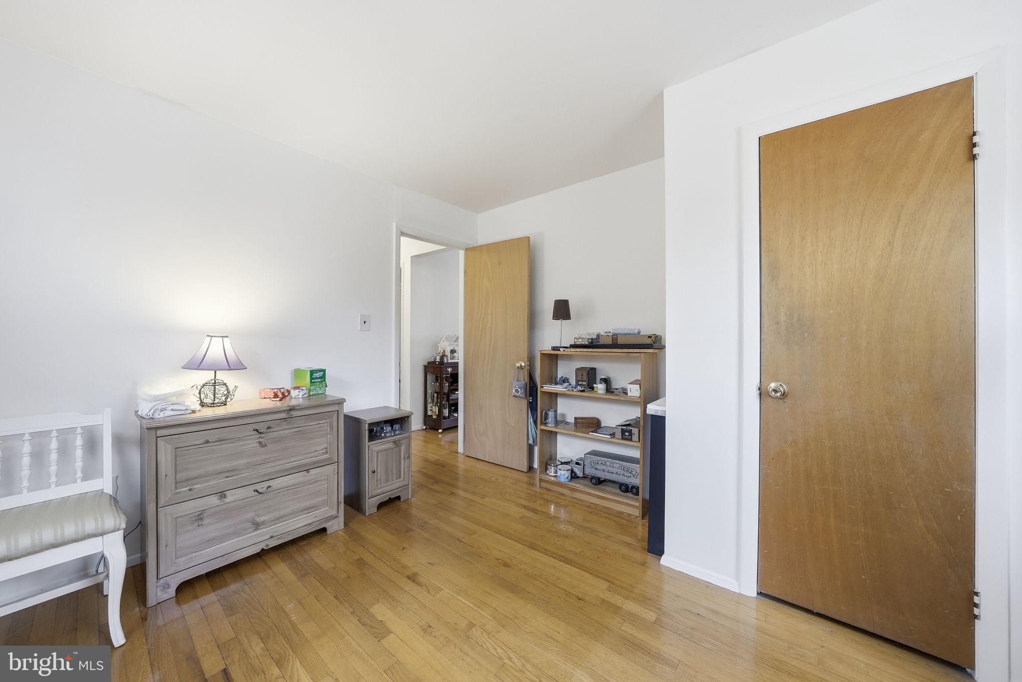 14506 Danville Road Woodbridge, VA 22193 - Photo 14 of 26 a room with furniture and wooden floor