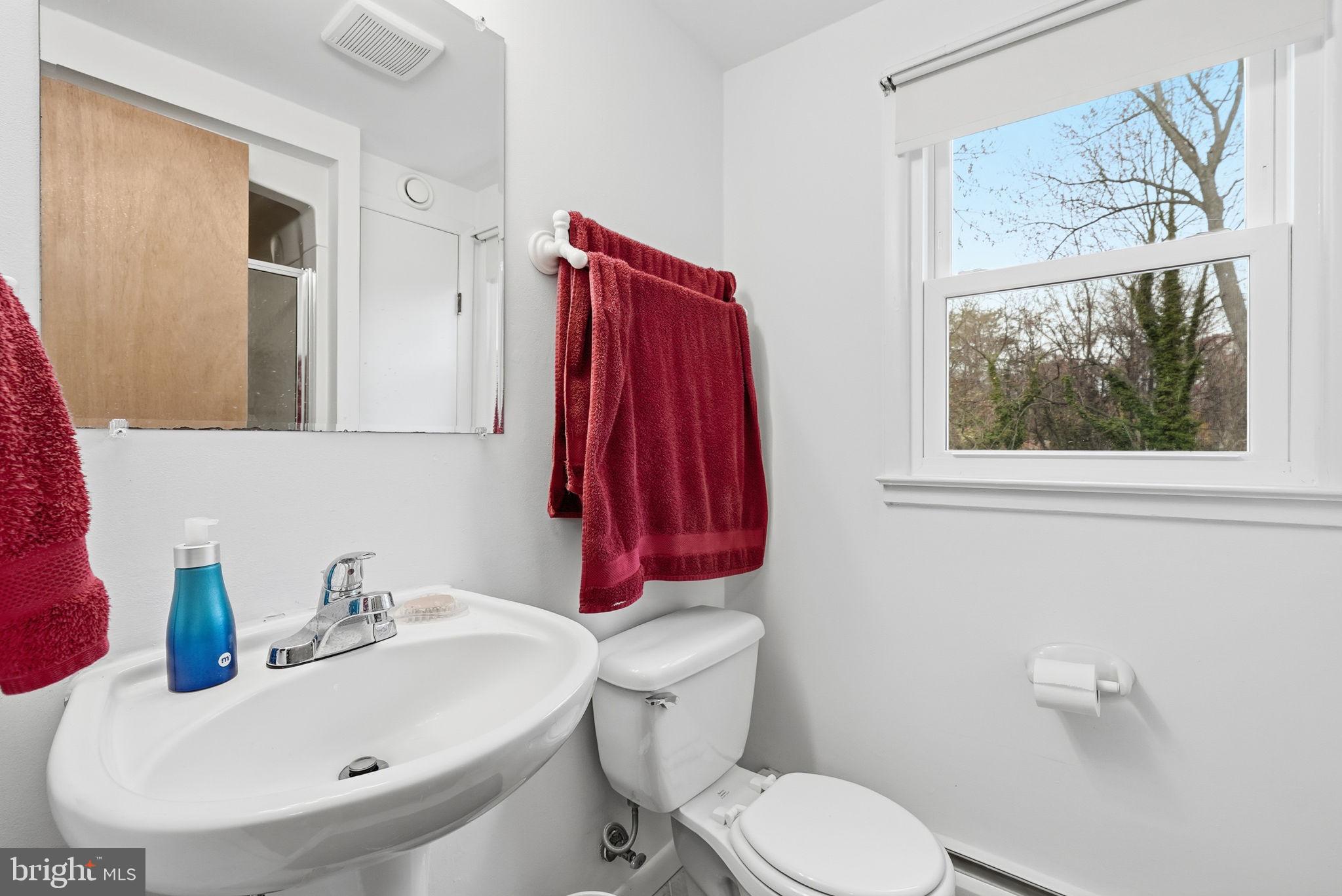 14506 Danville Road Woodbridge, VA 22193 - Photo 17 of 26 a bathroom with a sink and a mirror