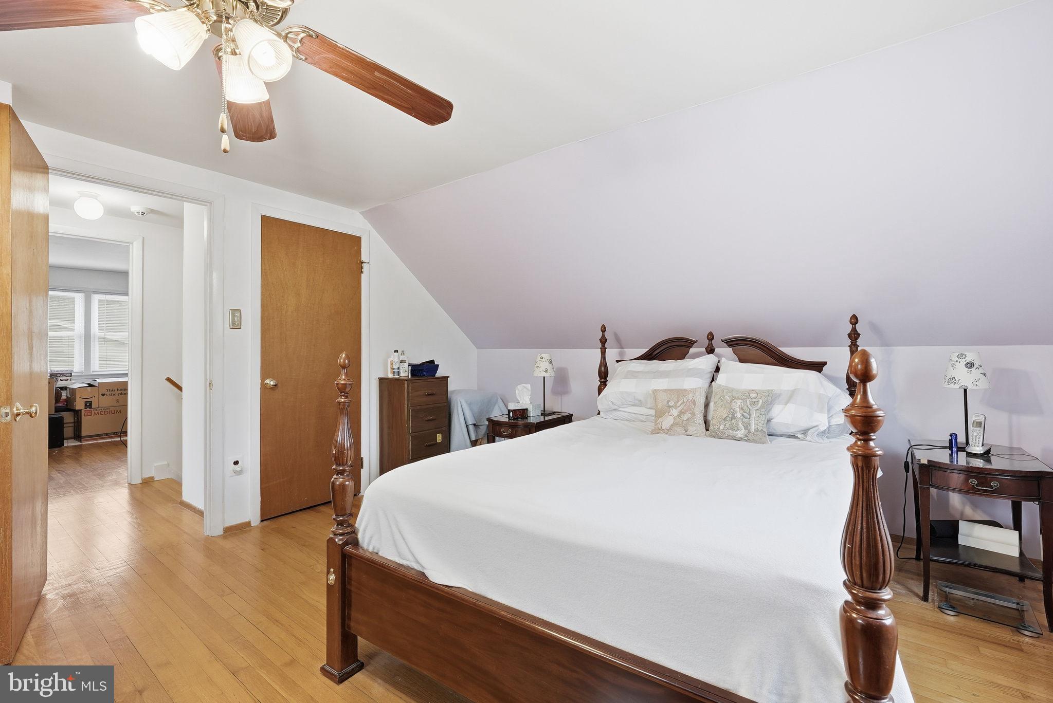 14506 Danville Road Woodbridge, VA 22193 - Photo 19 of 26 a spacious bedroom with a bed and a walk in closet