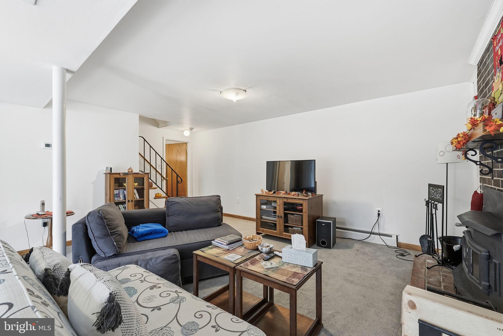 14506 Danville Road Woodbridge, VA 22193 - Photo 20 of 26 a living room with furniture and a flat screen tv