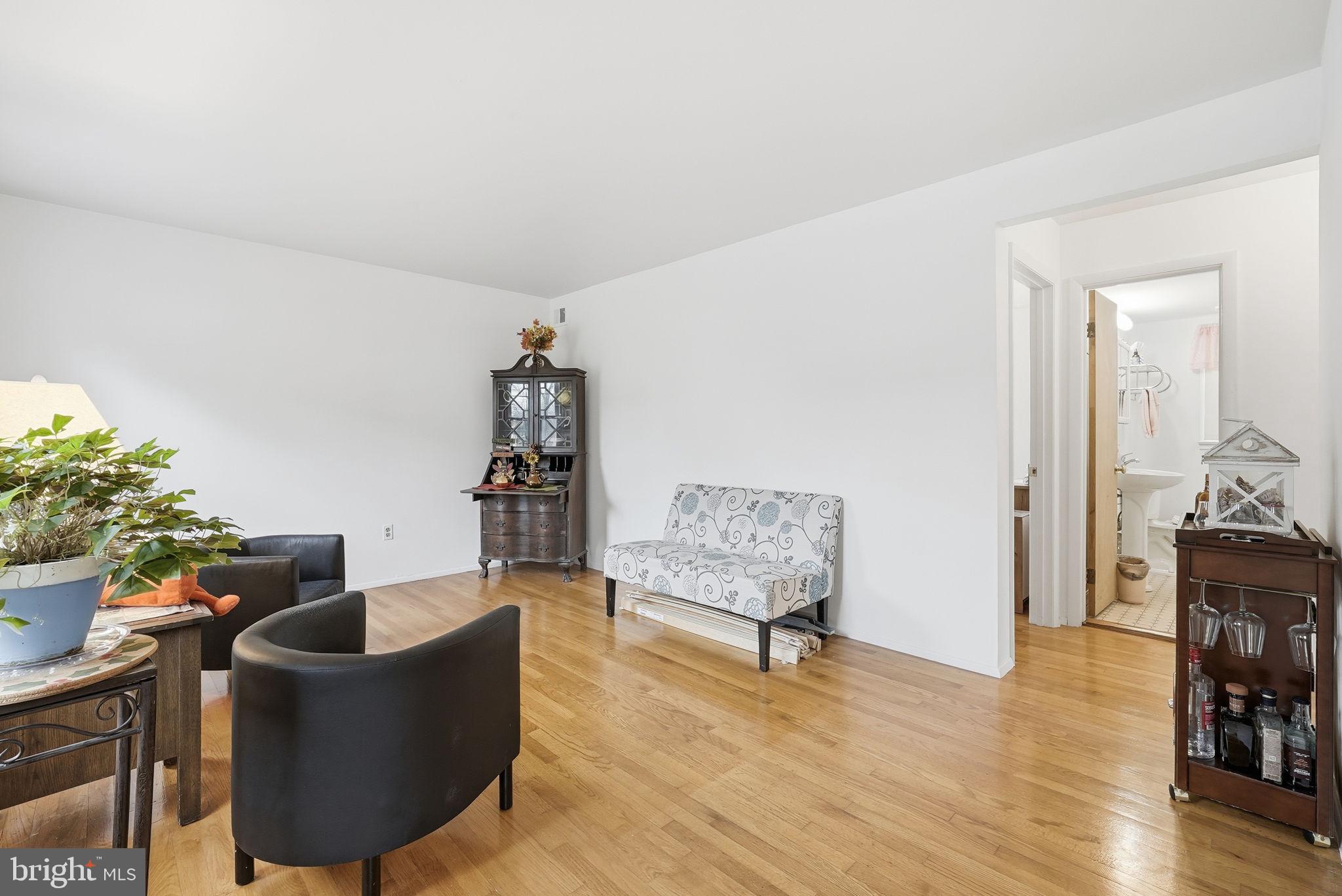 14506 Danville Road Woodbridge, VA 22193 - Photo 4 of 26 a living room with furniture and a wooden floor