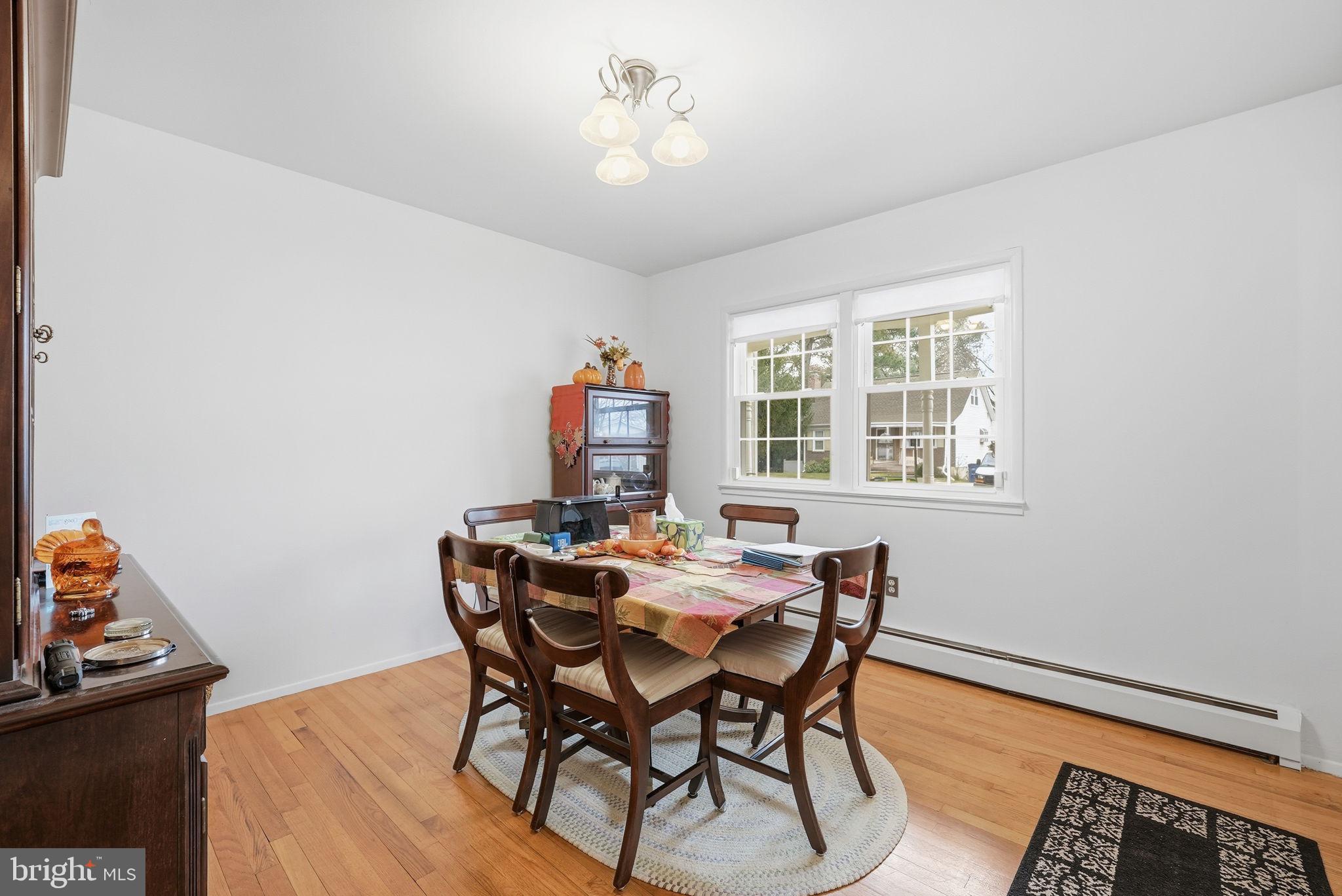 14506 Danville Road Woodbridge, VA 22193 - Photo 8 of 26 a view of a dining room with furniture and a chandelier