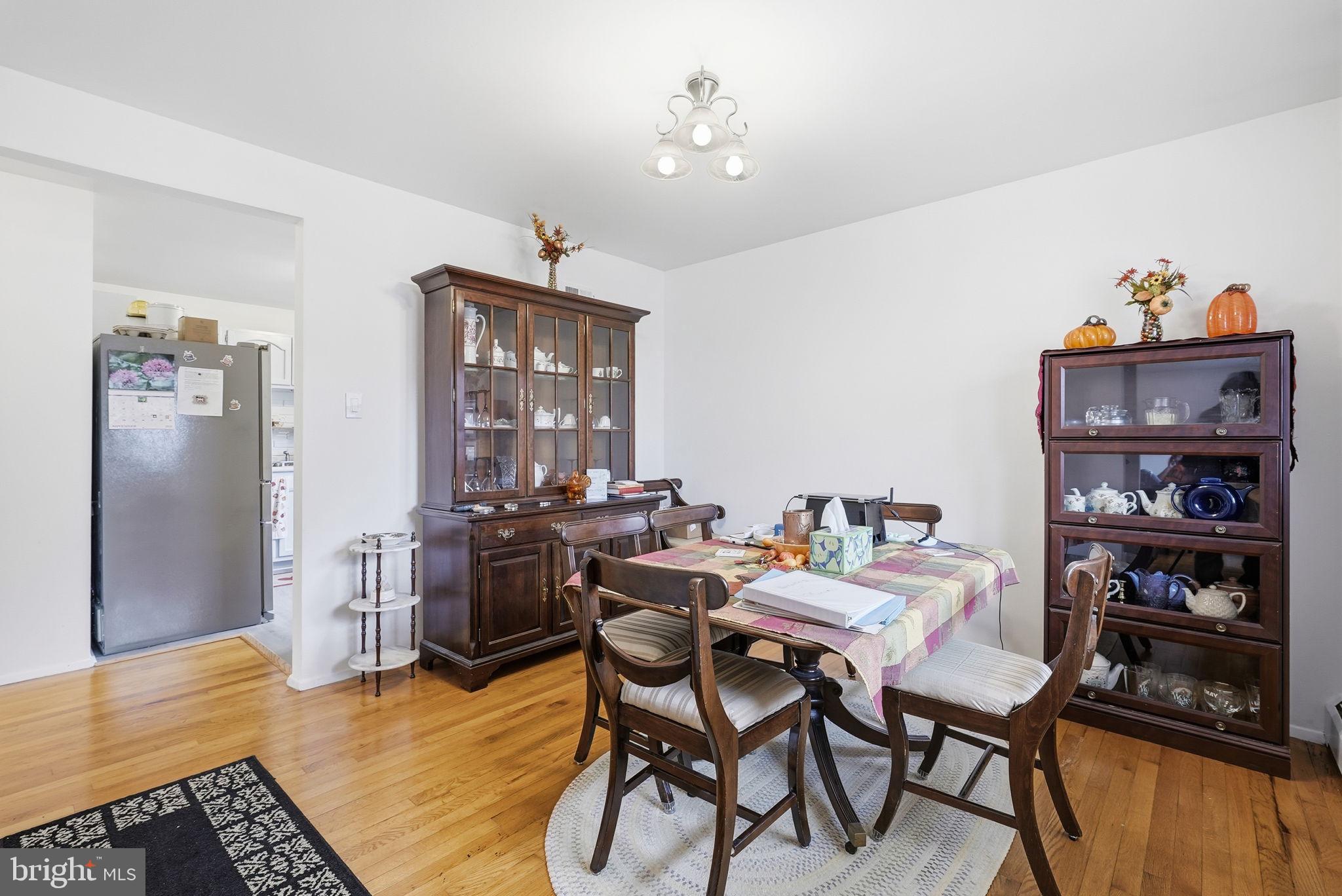 14506 Danville Road Woodbridge, VA 22193 - Photo 9 of 26 a view of a dining room with furniture and wooden floor